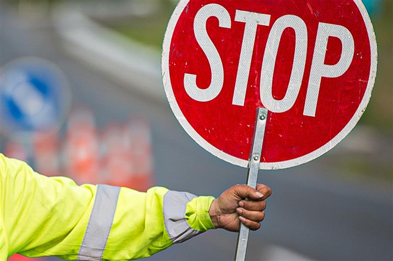 Hand Holding a Stop sign